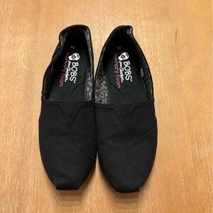 Woman’s Skechers Bobs Black Flats